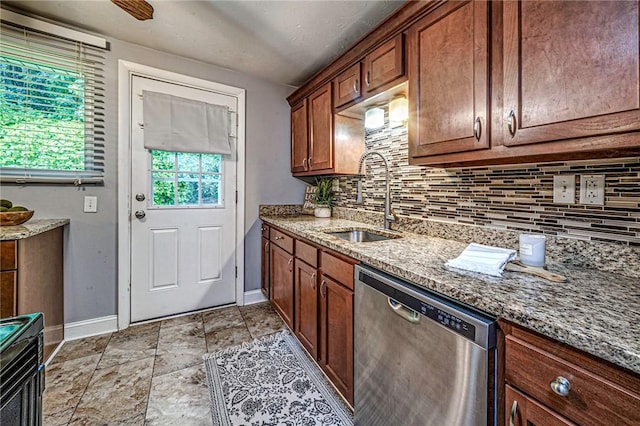 125 Holstein Dr, North Fayette, PA 15071 - kitchen with stainless steel dishwasher, decorative backsplash, light stone counters, light stone finish floors, and brown cabinets