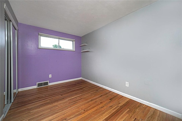 125 Holstein Dr, North Fayette, PA 15071 - spare room featuring wood finished floors and baseboards