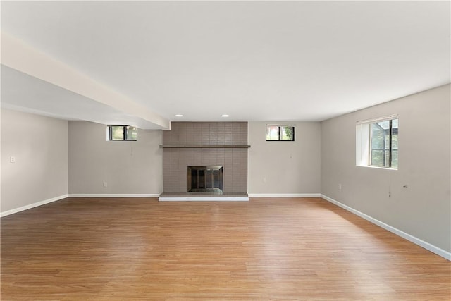 900 Tottenham Dr, Coraopolis, PA 15108 - unfurnished living room with a brick fireplace, light wood-style floors, and recessed lighting