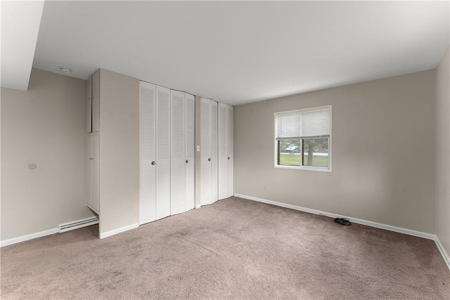 900 Tottenham Dr, Coraopolis, PA 15108 - unfurnished bedroom with carpet flooring and a baseboard heating unit