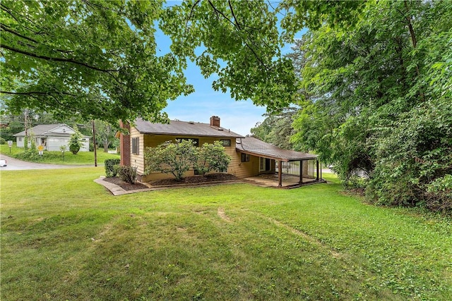 900 Tottenham Dr, Coraopolis, PA 15108 - rear view of house featuring a chimney and a yard