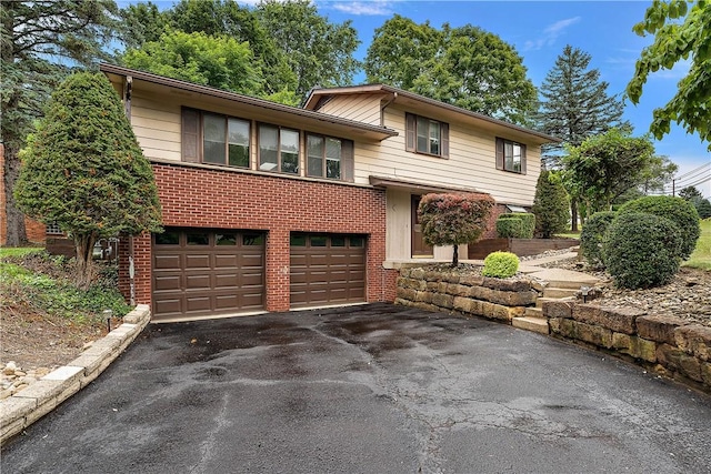 900 Tottenham Dr, Coraopolis, PA 15108 - split level home featuring brick siding, driveway, and a garage