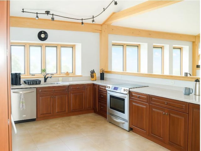 405 Hogg Rd, Worthington, PA 16262 - kitchen with stainless steel appliances, light countertops, brown cabinetry, and light tile patterned floors