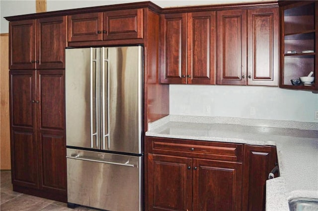 405 Hogg Rd, Worthington, PA 16262 - kitchen featuring high end fridge, light countertops, dark brown cabinets, and tile patterned flooring