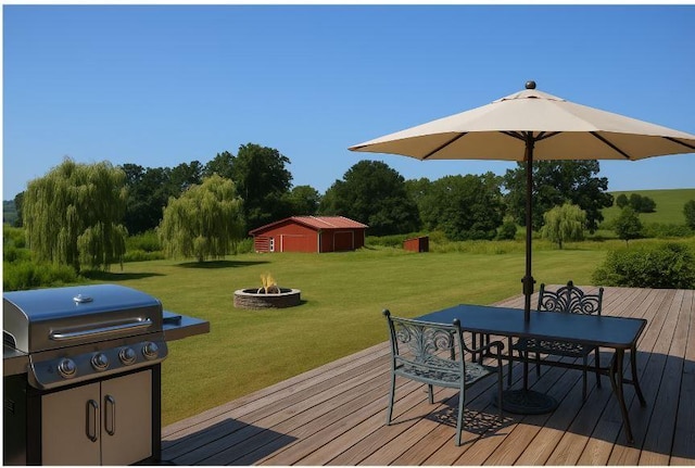 405 Hogg Rd, Worthington, PA 16262 - deck featuring an outdoor fire pit, a yard, a grill, outdoor dining space, and an outdoor structure