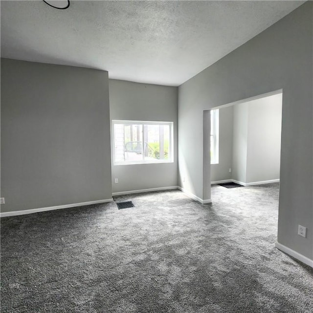 1914 Arlington Ave, Arlington, PA 15210 - carpeted spare room featuring a textured ceiling and baseboards