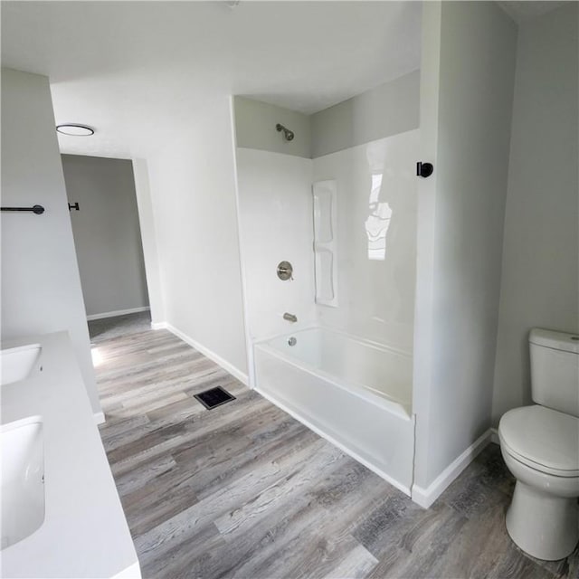 1914 Arlington Ave, Arlington, PA 15210 - full bathroom with wood finished floors, shower / bathtub combination, and double vanity