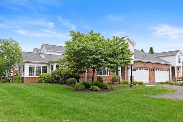 202 Providence Ct, Adams Twp, PA 16059 - view of front of property with brick siding, a garage, driveway, and a front yard