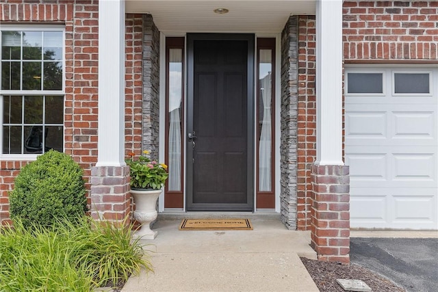 202 Providence Ct, Adams Twp, PA 16059 - entrance to property with brick siding, a porch, and an attached garage