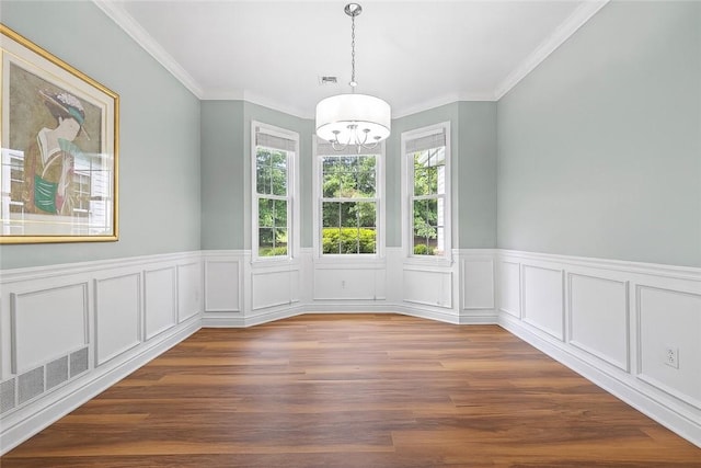 202 Providence Ct, Adams Twp, PA 16059 - unfurnished dining area featuring a chandelier, a wainscoted wall, dark wood finished floors, and crown molding