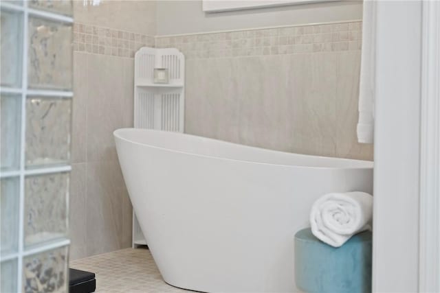 202 Providence Ct, Adams Twp, PA 16059 - bathroom featuring a freestanding bath and tile walls