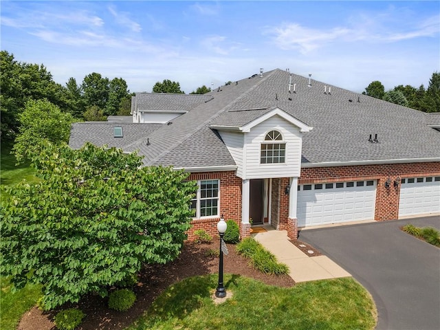 202 Providence Ct, Adams Twp, PA 16059 - traditional home featuring driveway, brick siding, a shingled roof, and a garage