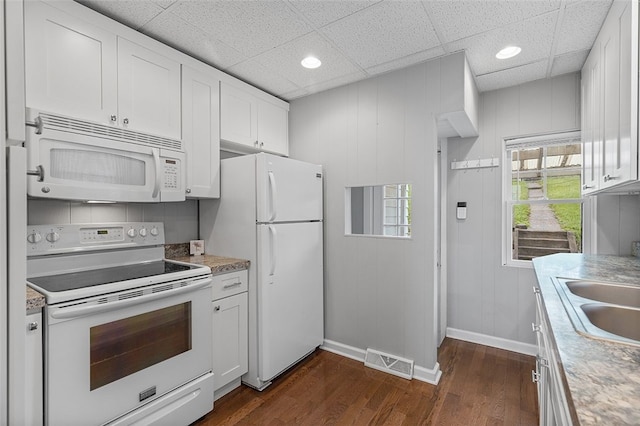 447 Highfield, Canonsburg, PA 15317 - kitchen with white appliances, dark wood-type flooring, white cabinetry, light countertops, and a drop ceiling
