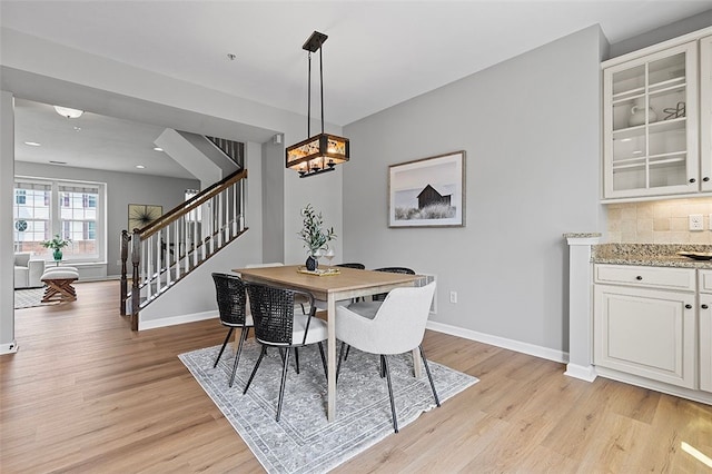 1009 Grey Fox Cir, Bridgeville, PA 15017 - dining area with stairs and light wood finished floors