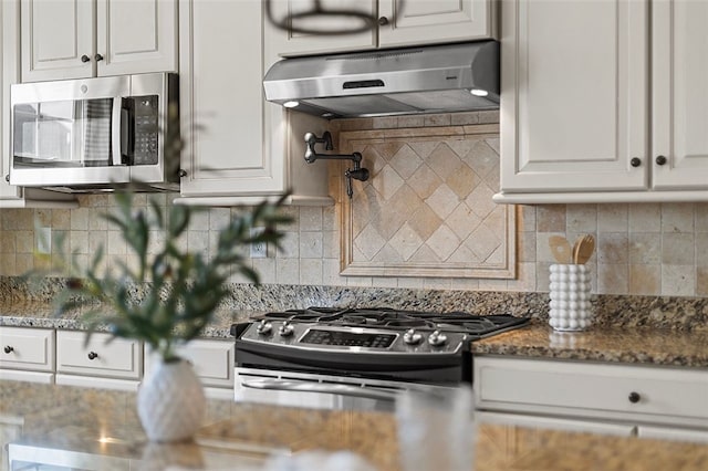 1009 Grey Fox Cir, Bridgeville, PA 15017 - kitchen with under cabinet range hood, appliances with stainless steel finishes, white cabinets, and backsplash