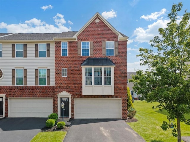1009 Grey Fox Cir, Bridgeville, PA 15017 - view of front facade with a garage, brick siding, and driveway