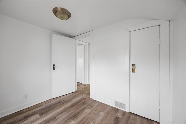 1 Core, City Of Washington, PA 15301 - unfurnished bedroom with wood finished floors and lofted ceiling