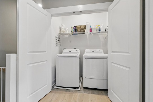 349 Azalea, Peters Twp, PA 15367 - laundry area featuring washing machine and dryer and light wood finished floors