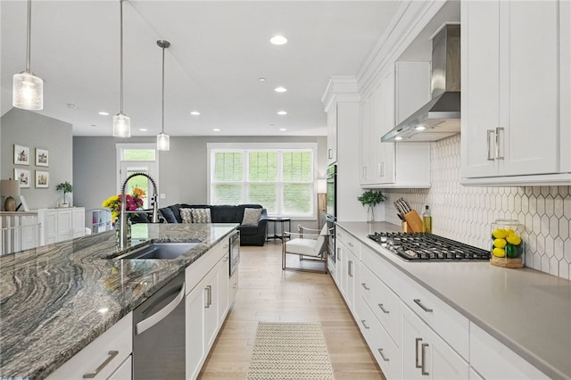 349 Azalea, Peters Twp, PA 15367 - kitchen featuring stainless steel appliances, open floor plan, wall chimney exhaust hood, white cabinets, and recessed lighting