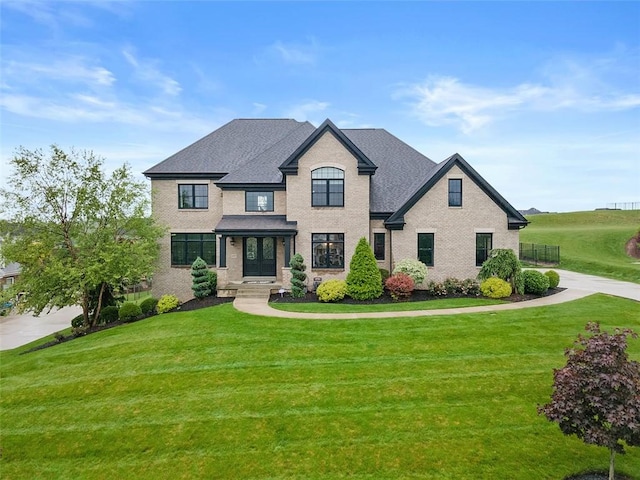 197 Wellington, Peters Twp, PA 15317 - french country home with a front yard and brick siding