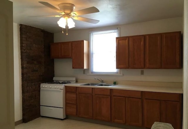 318 Mueller Ave, Crafton, PA 15205 - kitchen featuring white gas range oven, brown cabinets, light countertops, and a ceiling fan