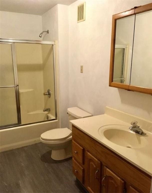 318 Mueller Ave, Crafton, PA 15205 - bathroom with wood finished floors, vanity, and combined bath / shower with glass door
