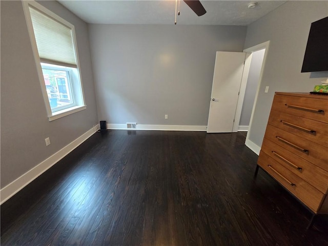 5303 Wickliff St, Lawrenceville, PA 15201 - unfurnished bedroom featuring dark wood-type flooring and a ceiling fan