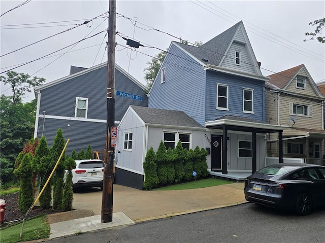 5303 Wickliff St, Lawrenceville, PA 15201 - view of front facade featuring roof with shingles