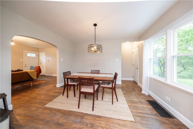 3715 Tuscarawas Rd, Brighton Twp, PA 15009 - dining area with arched walkways, plenty of natural light, wood finished floors, and a chandelier