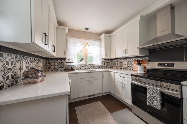 3715 Tuscarawas Rd, Brighton Twp, PA 15009 - kitchen featuring wall chimney range hood, stainless steel electric range, dark wood finished floors, white cabinetry, and decorative backsplash