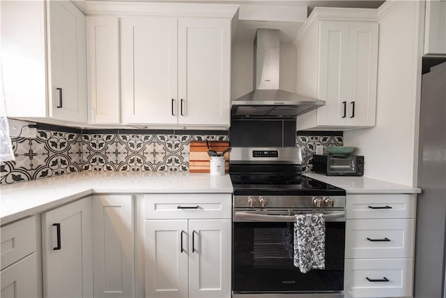 3715 Tuscarawas Rd, Brighton Twp, PA 15009 - kitchen featuring wall chimney range hood, stainless steel electric stove, refrigerator, white cabinets, and tasteful backsplash