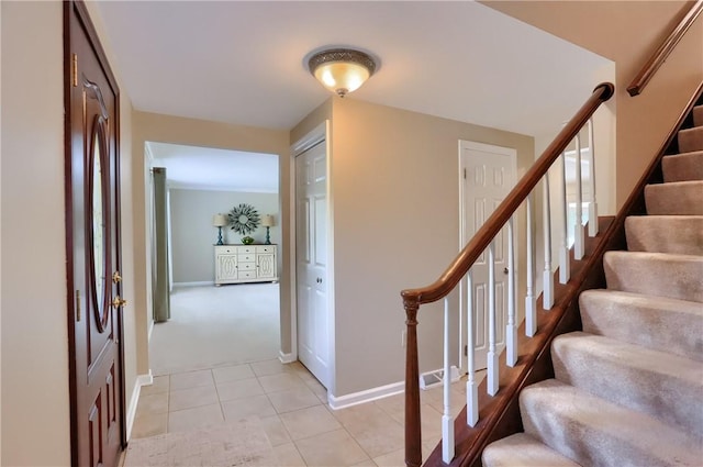 329 Oak Grove Ct, Mccandless, PA 15090 - foyer with stairs, light tile patterned flooring, and light colored carpet