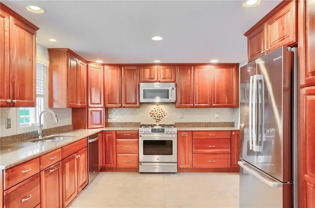 329 Oak Grove Ct, Mccandless, PA 15090 - kitchen featuring appliances with stainless steel finishes, backsplash, light stone countertops, and recessed lighting