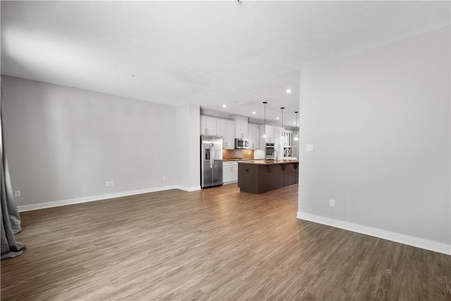 152 Cole Dr, Robinson Twp, PA 15136 - unfurnished living room featuring wood finished floors and recessed lighting