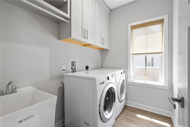 152 Cole Dr, Robinson Twp, PA 15136 - laundry room featuring cabinet space, light wood-style flooring, and washing machine and dryer