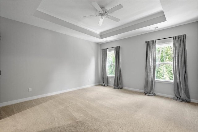 152 Cole Dr, Robinson Twp, PA 15136 - unfurnished room with a tray ceiling, plenty of natural light, light carpet, and a ceiling fan