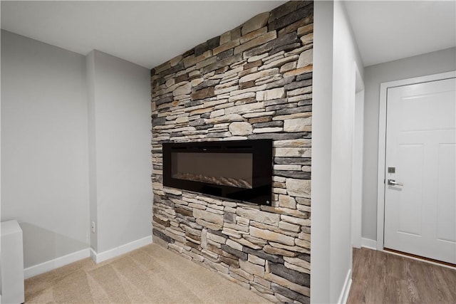 152 Cole Dr, Robinson Twp, PA 15136 - detailed view of baseboards and a glass covered fireplace