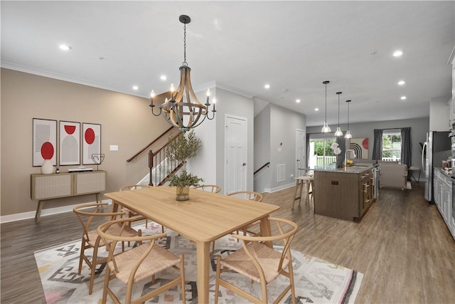 152 Cole Dr, Robinson Twp, PA 15136 - dining room featuring recessed lighting, stairs, light wood finished floors, and a chandelier