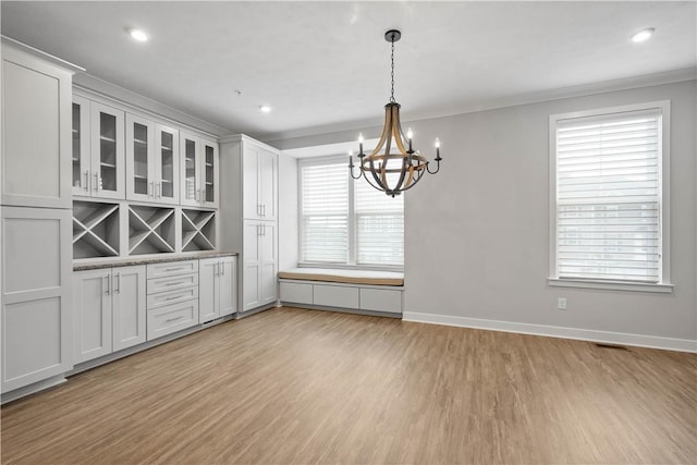 152 Cole Dr, Robinson Twp, PA 15136 - unfurnished dining area featuring a chandelier, light wood-style flooring, ornamental molding, and recessed lighting