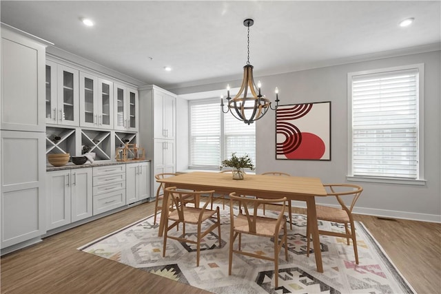 152 Cole Dr, Robinson Twp, PA 15136 - dining space featuring a chandelier, light wood-style flooring, crown molding, and recessed lighting