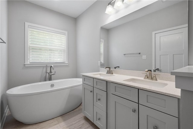 152 Cole Dr, Robinson Twp, PA 15136 - bathroom with double vanity, plenty of natural light, and a freestanding tub