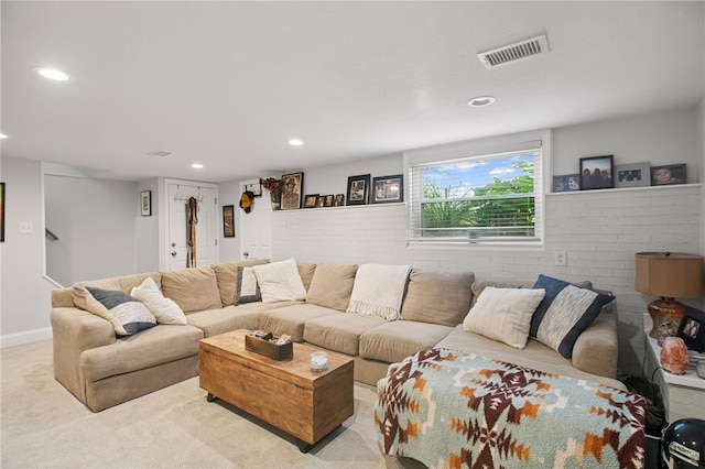 68 Cynthia Dr, Carnegie, PA 15106 - carpeted living area with brick wall and recessed lighting