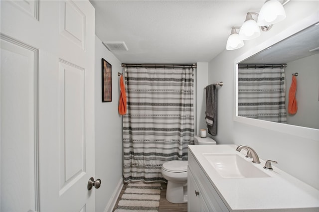68 Cynthia Dr, Carnegie, PA 15106 - bathroom with vanity, wood finished floors, a shower with shower curtain, and a textured ceiling