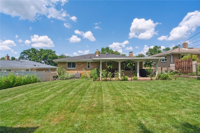 68 Cynthia Dr, Carnegie, PA 15106 - rear view of property with a chimney and brick siding