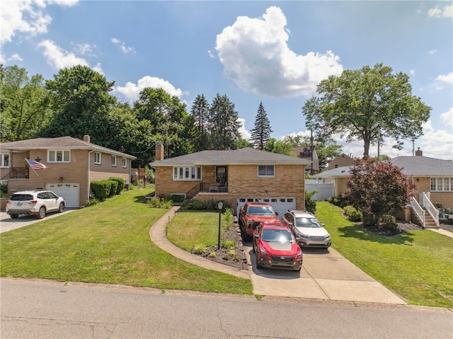 68 Cynthia Dr, Carnegie, PA 15106 - view of front of home with driveway, an attached garage, brick siding, a front yard, and stairs