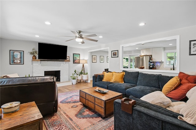 68 Cynthia Dr, Carnegie, PA 15106 - living room featuring ceiling fan, recessed lighting, light wood-type flooring, and a fireplace with raised hearth