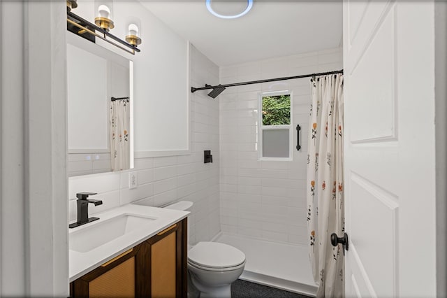 334 Shaler St, Mt Washington, PA 15211 - bathroom featuring tile walls, vanity, tiled shower, and decorative backsplash