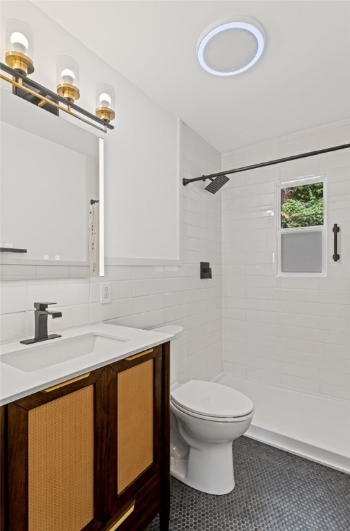 334 Shaler St, Mt Washington, PA 15211 - full bathroom featuring tile walls, vanity, tile patterned flooring, and tiled shower