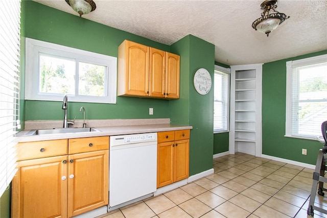 901 Alexander St, Shaler, PA 15116 - kitchen with dishwasher, built in features, a textured ceiling, light countertops, and light tile patterned flooring
