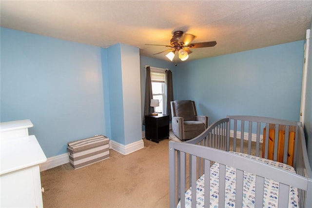 901 Alexander St, Shaler, PA 15116 - bedroom featuring light carpet, a ceiling fan, and a crib